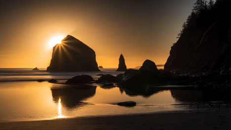 sunset at a rocky beach with sea stacks