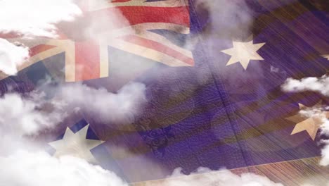 Animation-of-clouds-moving-over-waving-flag-of-australia,-wood,-sunlight-and-blue-sky