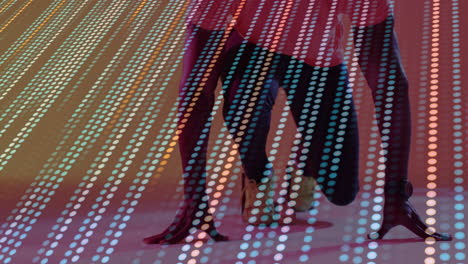 two athletes preparing for sprint start with glowing data dots, running shoes in sports tech demo