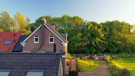 aerial view of houses and fields at sunset