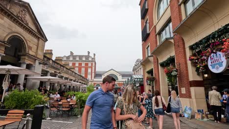 people walking in a bustling city street