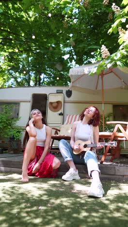 two friends enjoying music outdoors