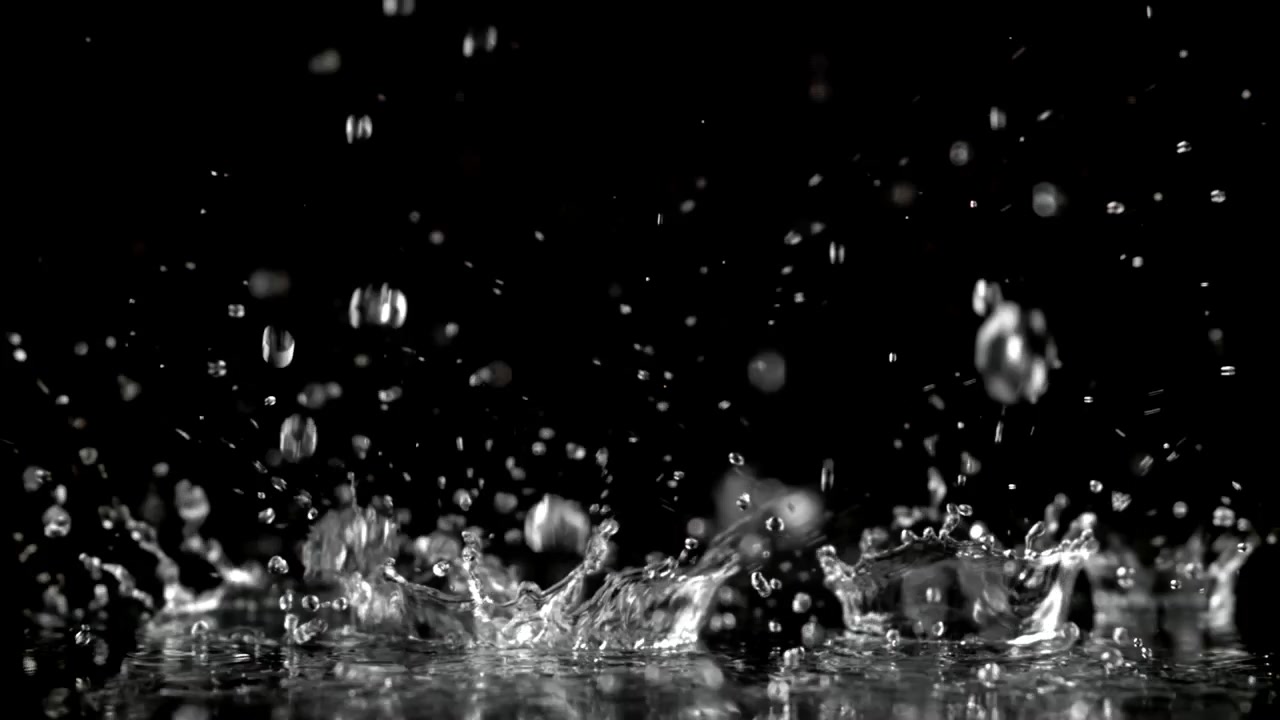 Slow Motion Water Drops Splashing on a Black Background