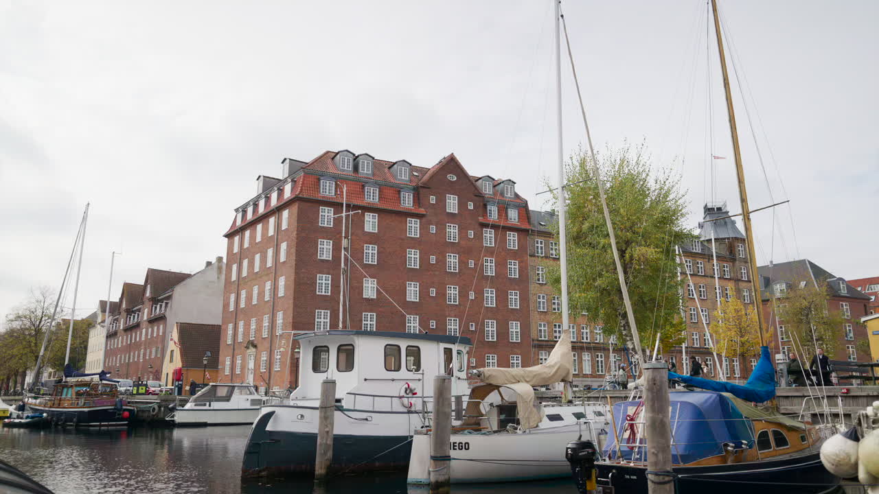 Boats docked on the Christianshavn Canal in the Christianshavn neighbourhood of Copenhagen, Denmark