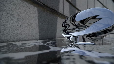 abstract glass sculpture reflection on stone