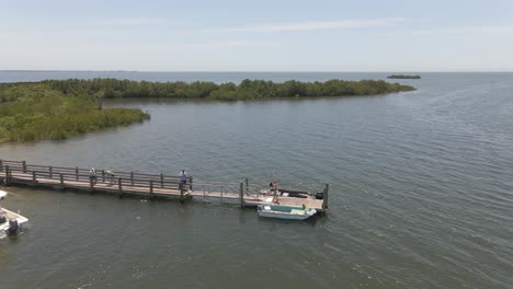 boat launch to the ocean in the middle of mangroves in florida, aerial view