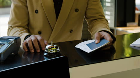 African-american-man-waiting-at-the-entrance-of-a-hotel