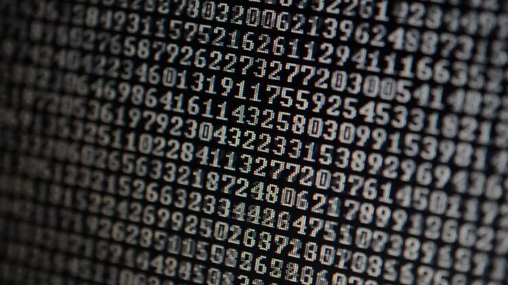 Binary code on the monitor screen. Shooting of a binary code, background