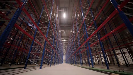 big and modern warehouse under construction, featuring metal shelving and other industrial equipment.