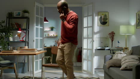 african american man having phone talk at home