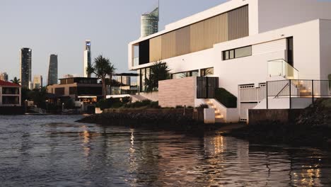 time-lapse of modern buildings along a bustling river