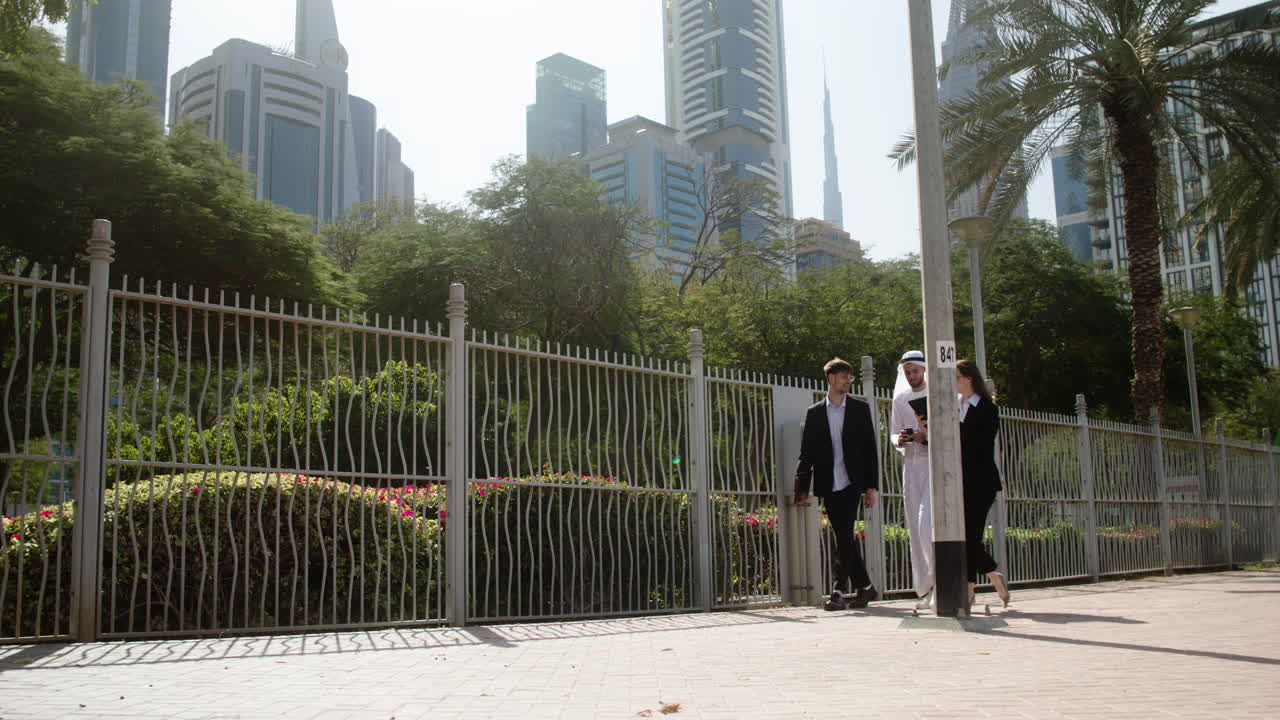 Three people talking about business