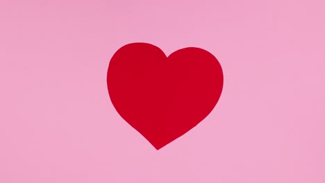 el gran corazón rojo del día de san valentín en tema rosa. detenga el movimiento