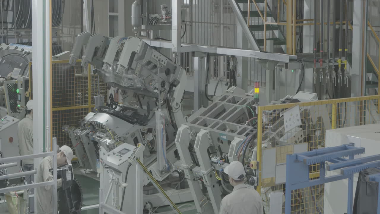 Industrial professional workers assemble a vehicle body, press a metal steel sheet in factory to makes the parts cars