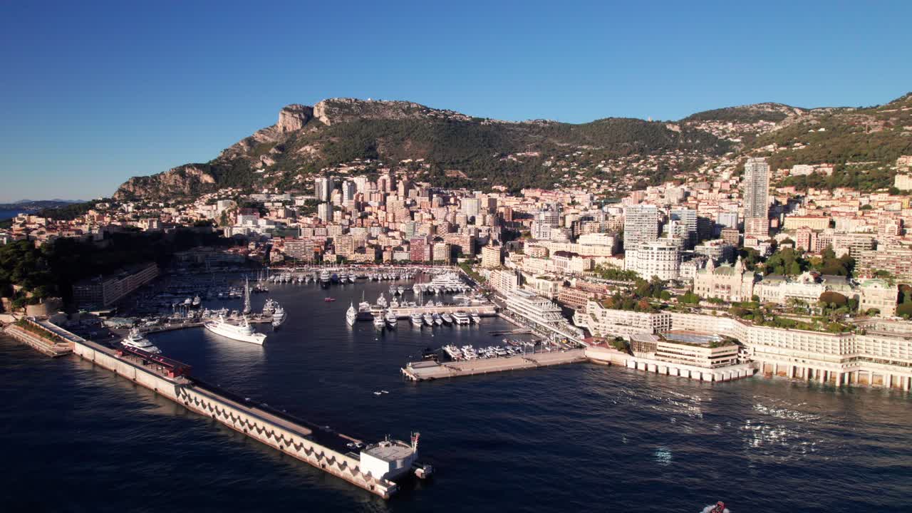Luxury Yachts docked in Monaco's Port Hurcule, 4K aerial