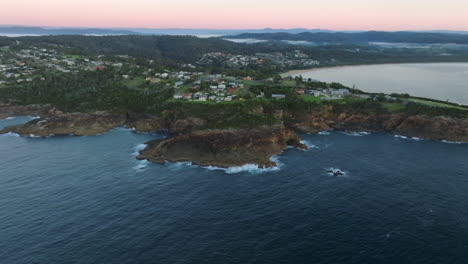 high up drone shot of tathra and the surrounding landscape on south coast nsw, australia