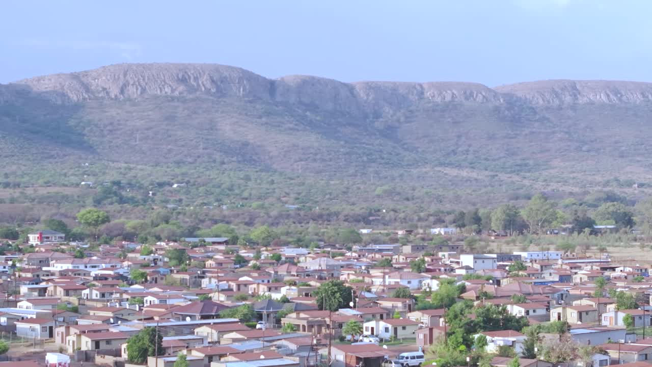 Mall of africa township in midrand, showing homes and mountain backdrop, aerial view