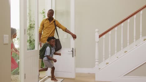 Two-generation-family-entering-their-house