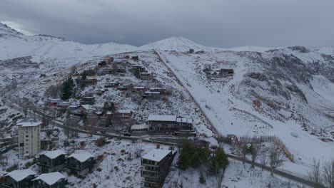 Slow-establishing-shot-of-the-small-Farellones-village-on-the-side-of-an-Andean-Mountain