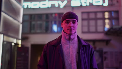 young man in a city at night