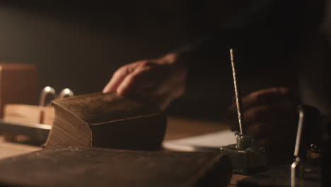 old passionate man read a book in his office at night