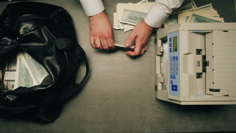 specialised police officer counting dollar banknotes in crime lab, conceptual image. high quality 4k footage