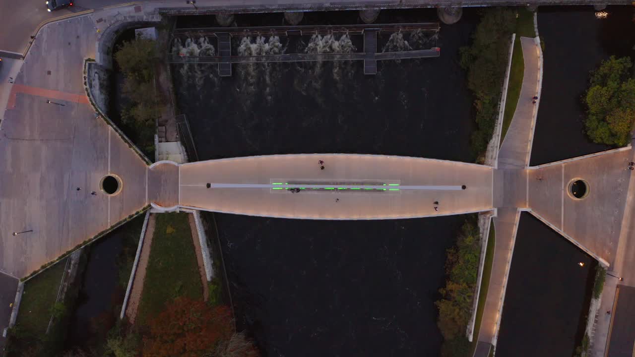 Aerial Top-Down View of Galway's Salmon Weir Pedestrian and Cycle Bridge during Twilight