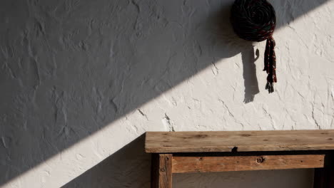 rustic wooden table against textured wall