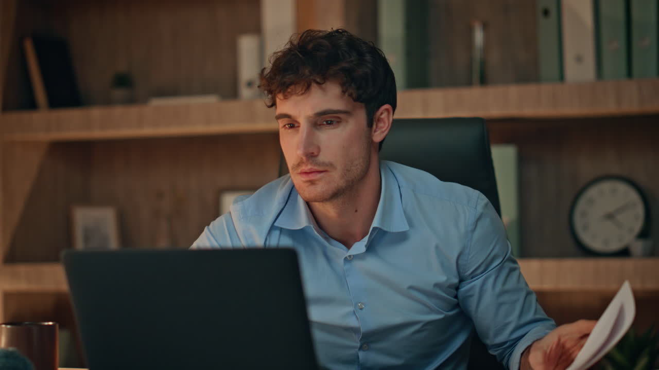 Angry businessman disappointed failure looking laptop at evening office close up