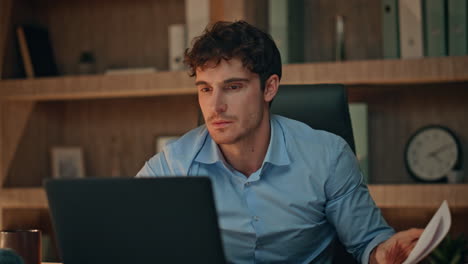 angry businessman disappointed failure looking laptop at evening office close up