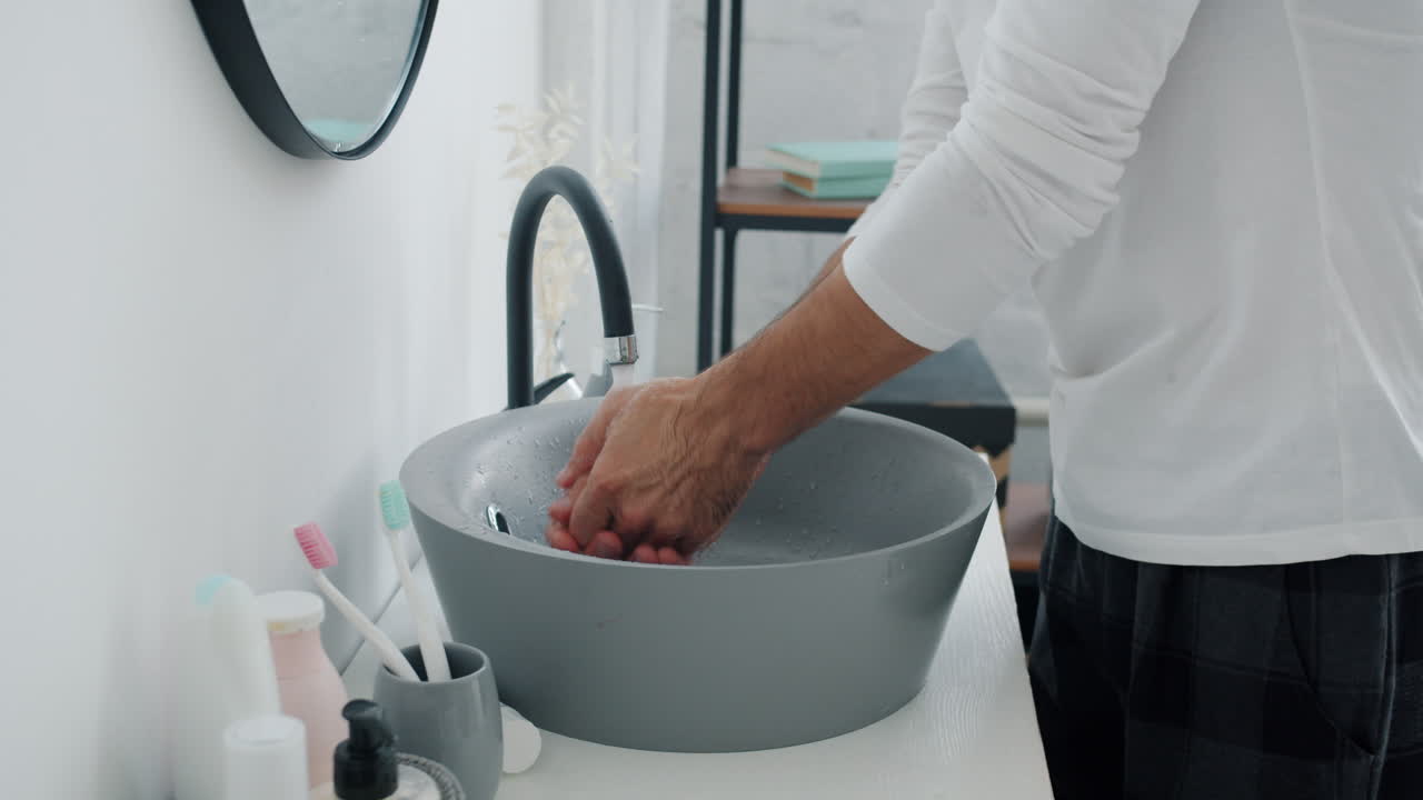 Man Washing Face and Styling Hair