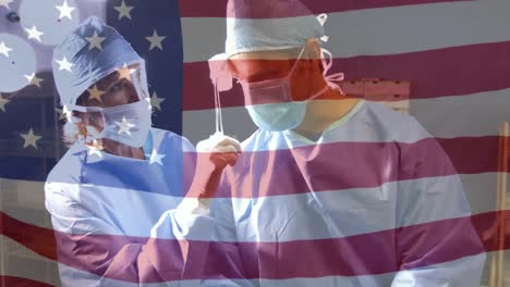 Animation-of-flag-of-usa-waving-over-surgeons-in-face-masks