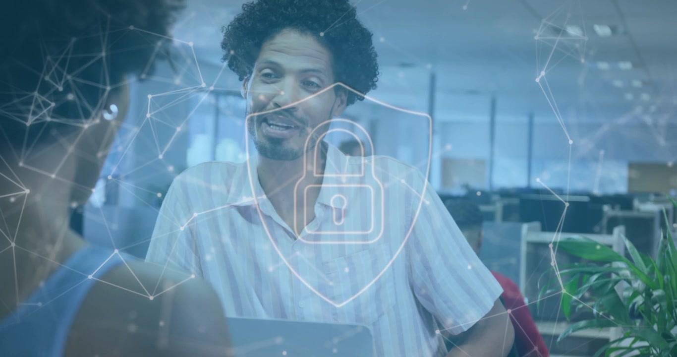 Colleagues Discussing Work in Modern Office with Digital Security Overlay