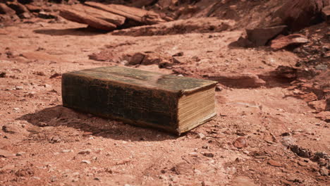 old book in red rock desert