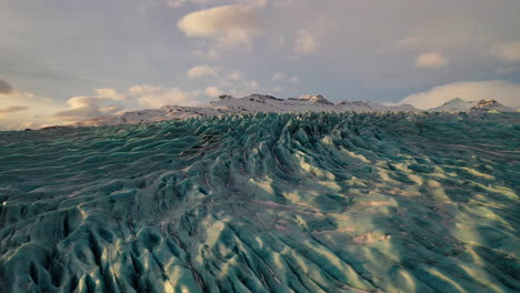 amazing snow formation in falljokull glacier outlet in south iceland - drone shot (forward)