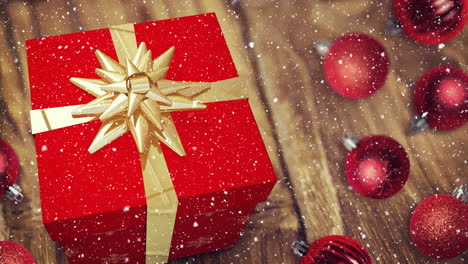 nieve cayendo con el regalo de navidad