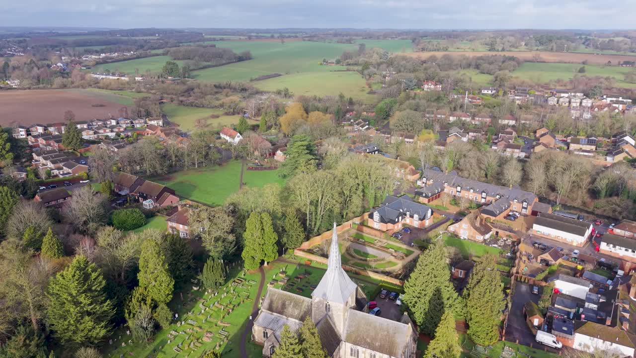 Drone flies over Wheathampstead, church, Serpentine wall and fields