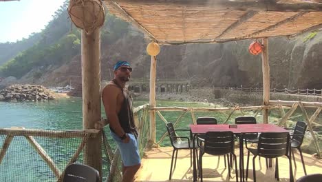 man in a mediterranean beach bar