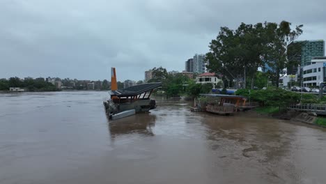 Low-angle-drone-shot-of-destroyed-city-cat-boat-ferry-terminal