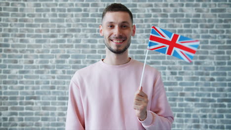 man holding a british flag