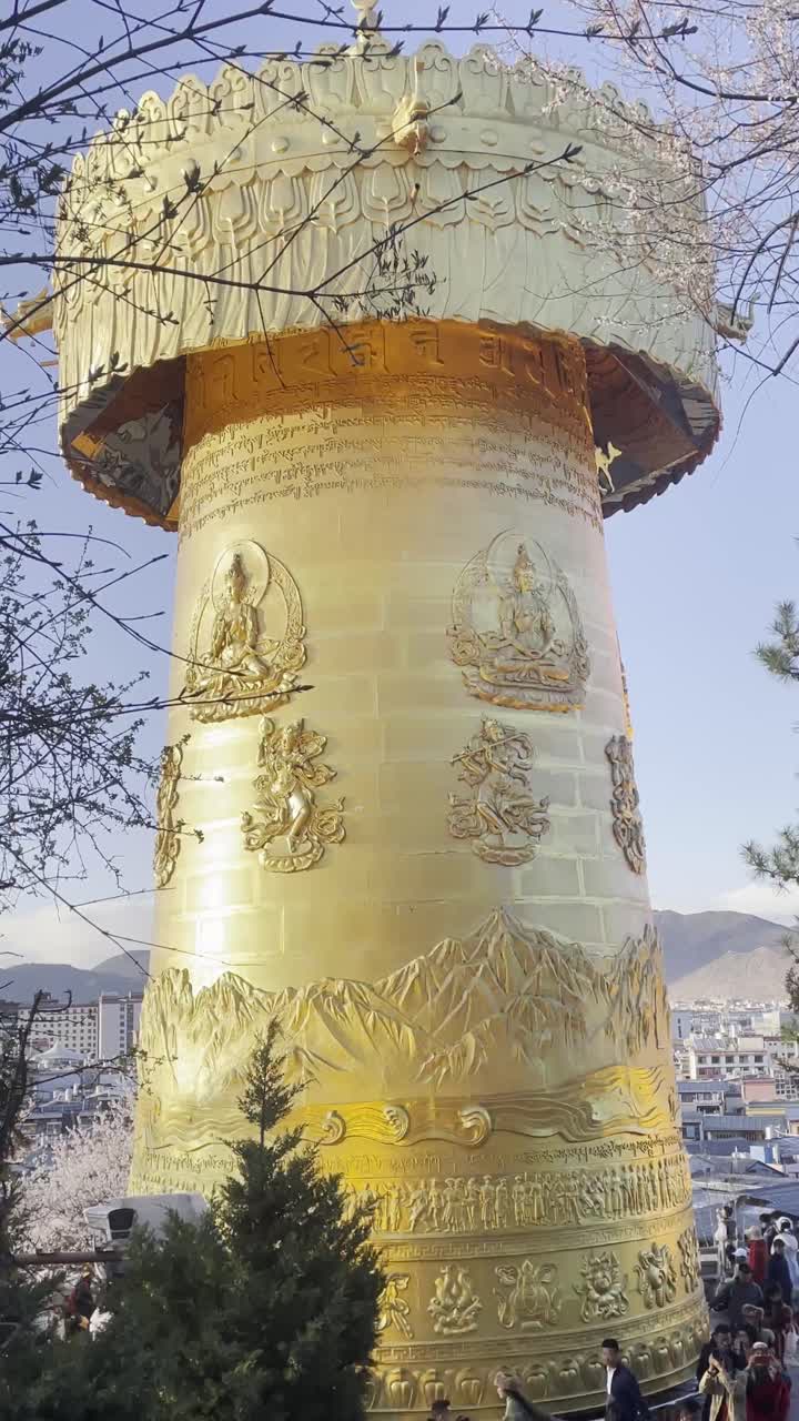 Temple Golden Prayer Wheel at Tibetan Monastery in Shangri-La, China, Vertical view