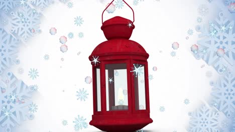 animation of snow falling over christmas lantern