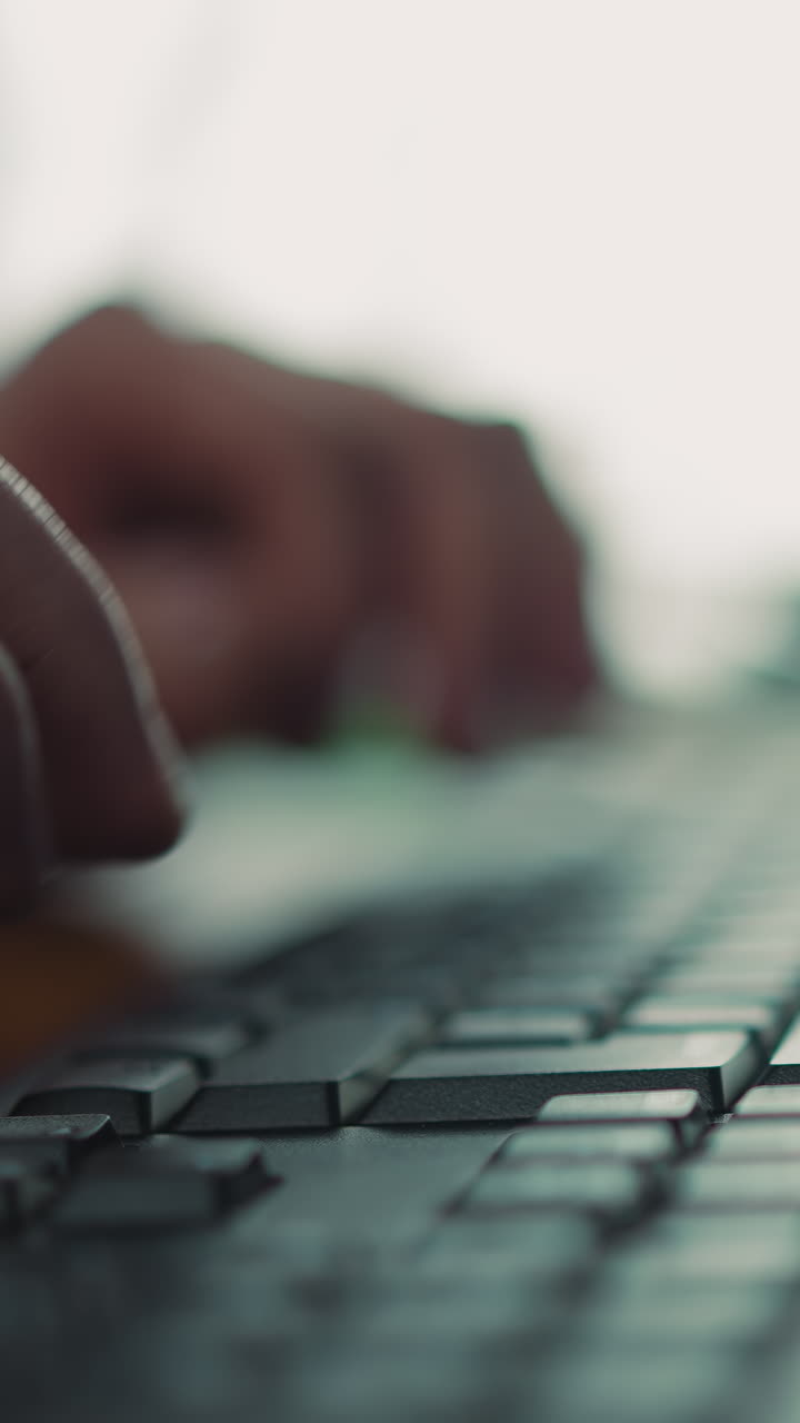 Employee presses Enter on computer keyboard working at table macro view. Programmer processes data on website with keypad at office workplace