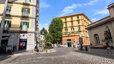 a tourist strolls through a sunny naples square