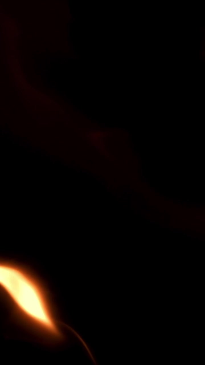 Dynamic Abstract Orange Light and Bokeh Particles on Black Background