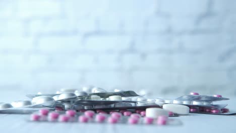 pile of assorted pills and medication packages