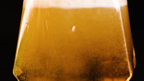 beer being poured and settling in glass