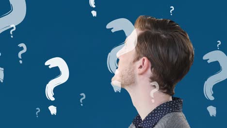 animación de signos de interrogación sobre el hombre caucásico en fondo azul