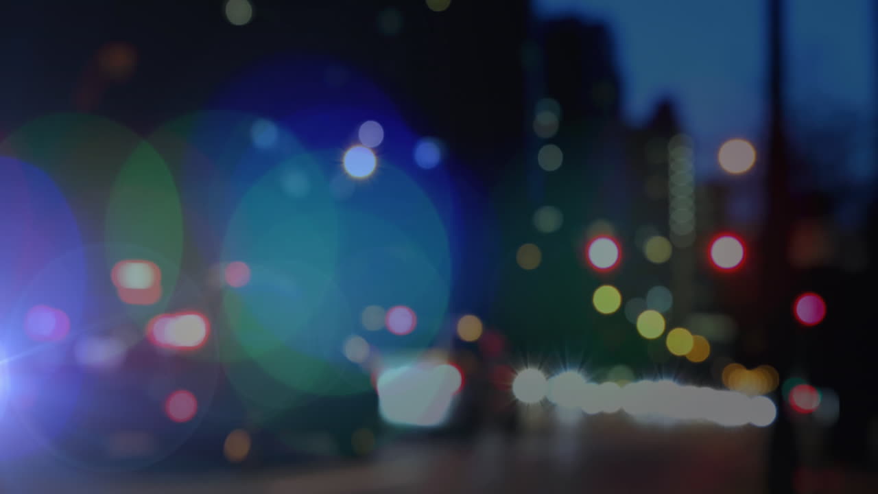animación de puntos brillantes de luz sobre el fondo de la ciudad fuera de foco