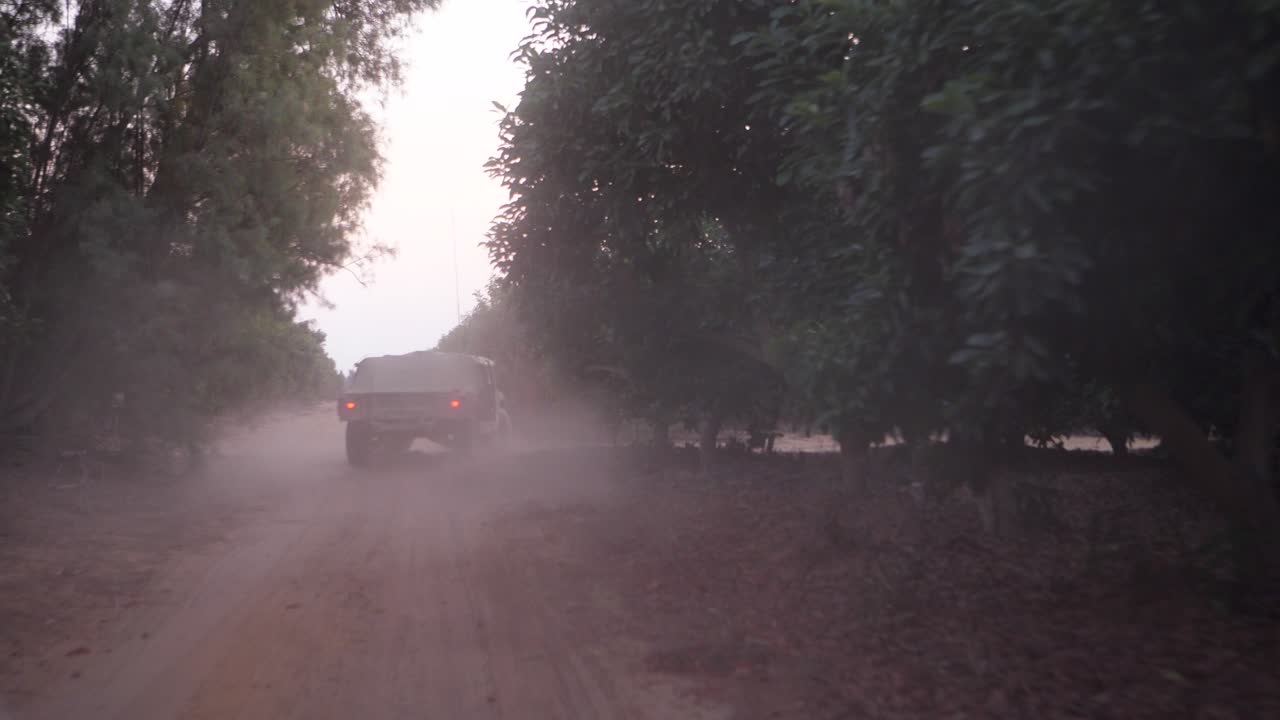 Israeli Army armored vehicles drive on a sandy road during an IDF military operation in the Golan Heights. Infantry combat soldiers. The Golan Heights is a plateau in southwestern Syria.
